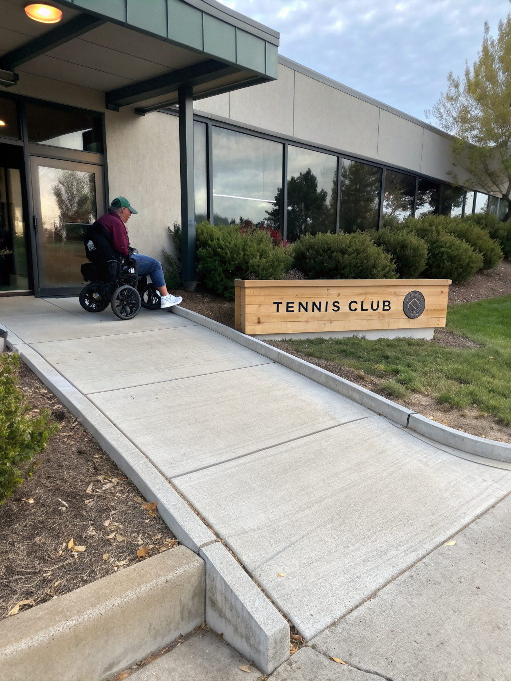Wheelchair accessible ramp leading to courts